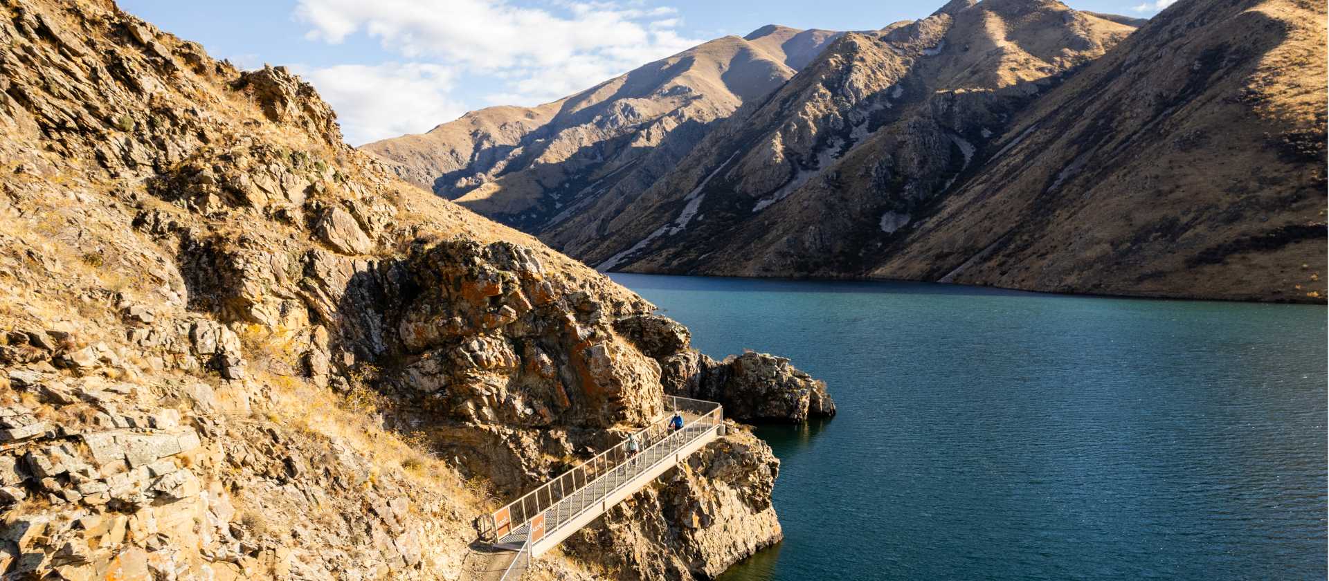 Cycling along the beautiful Benmore Dam on the Alps to Ocean. | Clare Toia-Bailey