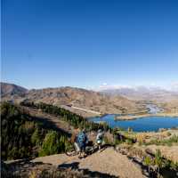 Cycling along the beautiful Benmore Dam on the Alps to Ocean. | Clare Toia-Bailey