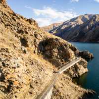 Cycling along the beautiful Benmore Dam on the Alps to Ocean. | Clare Toia-Bailey