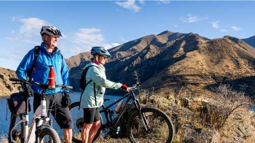 Cycling along the beautiful Benmore Dam on the Alps to Ocean. | Clare Toia-Bailey