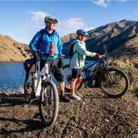 Cycling along the beautiful Benmore Dam on the Alps to Ocean. | Clare Toia-Bailey