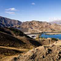 Cycling along the beautiful Benmore Dam on the Alps to Ocean. | Clare Toia-Bailey