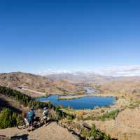 Cycling along the beautiful Benmore Dam on the Alps to Ocean. | Clare Toia-Bailey
