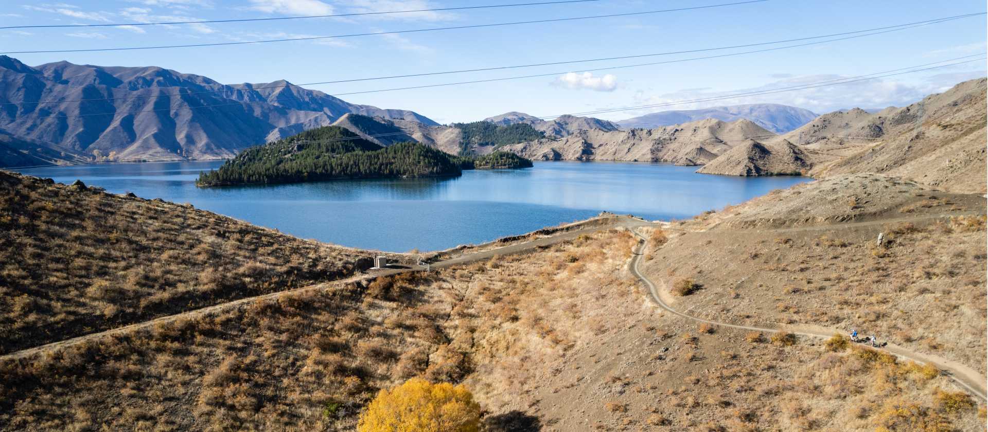 Cycling along the beautiful Benmore Dam on the Alps to Ocean. | Clare Toia-Bailey