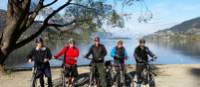 Cyclists in front of Lake Wakatipu on the Queenstown Trails