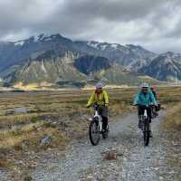 Cyclists riding through Southern Alps | Bec Adams